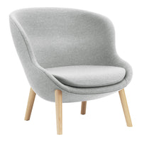 Light gray upholstered chair with smooth contours and natural wooden legs. Ideal for modern and minimalist decor.