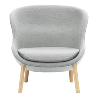 Light gray upholstered chair with a smooth, minimalist design and natural wood legs. Modern and elegant home decor.