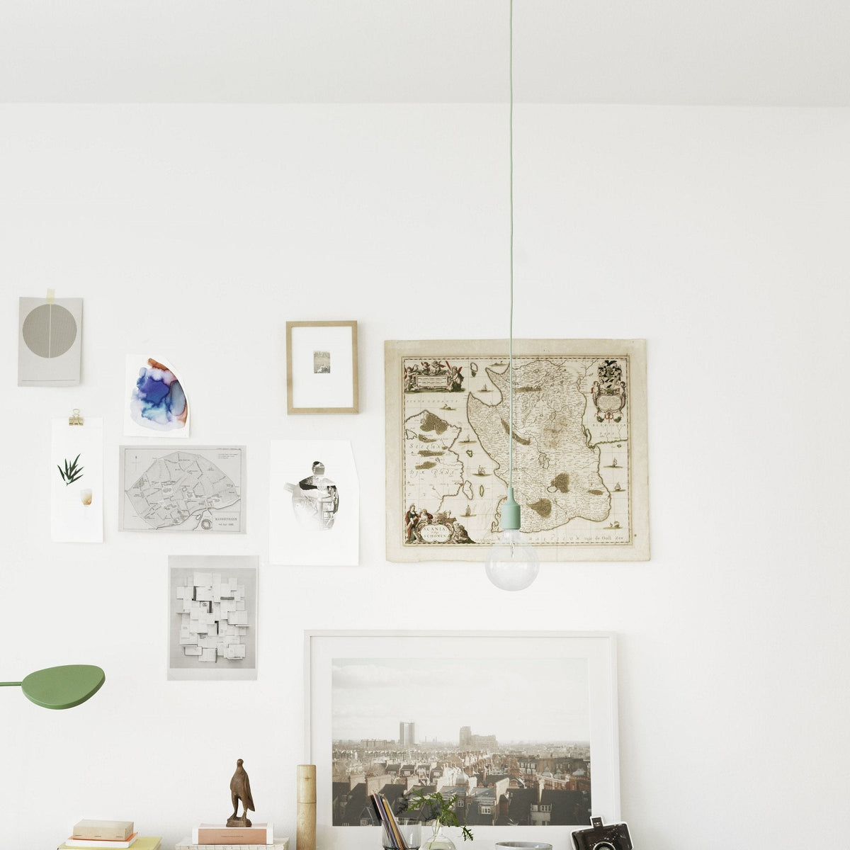 "Neutral wall decor featuring muted tones and diverse patterns in frames, enhancing modern interior aesthetics."