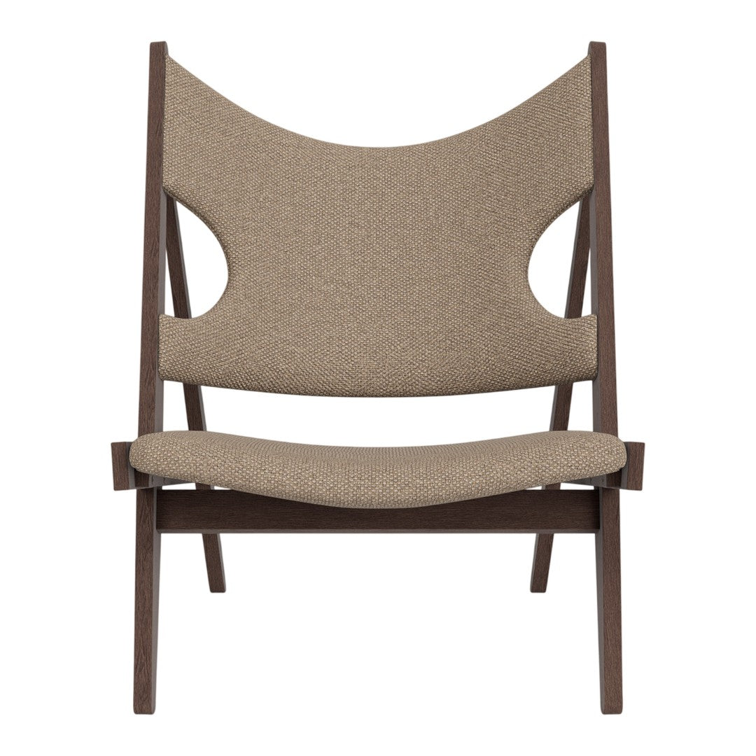 Brown patterned lounge chair with curved backrest and wooden frame, perfect for adding a modern touch to any space.