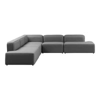 Grey sectional sofa with a minimalist design and clean lines, featuring a solid color without any patterns.