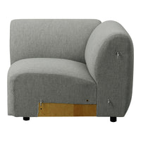 Gray fabric corner sofa with a rounded design, featuring a simple, modern pattern and sleek lines.