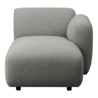Soft grey upholstered armchair with a modern, minimalistic design and smooth, rounded edges. Perfect for contemporary decor.