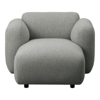 Cozy grey accent chair with smooth texture and modern, rounded design, perfect for contemporary interiors.