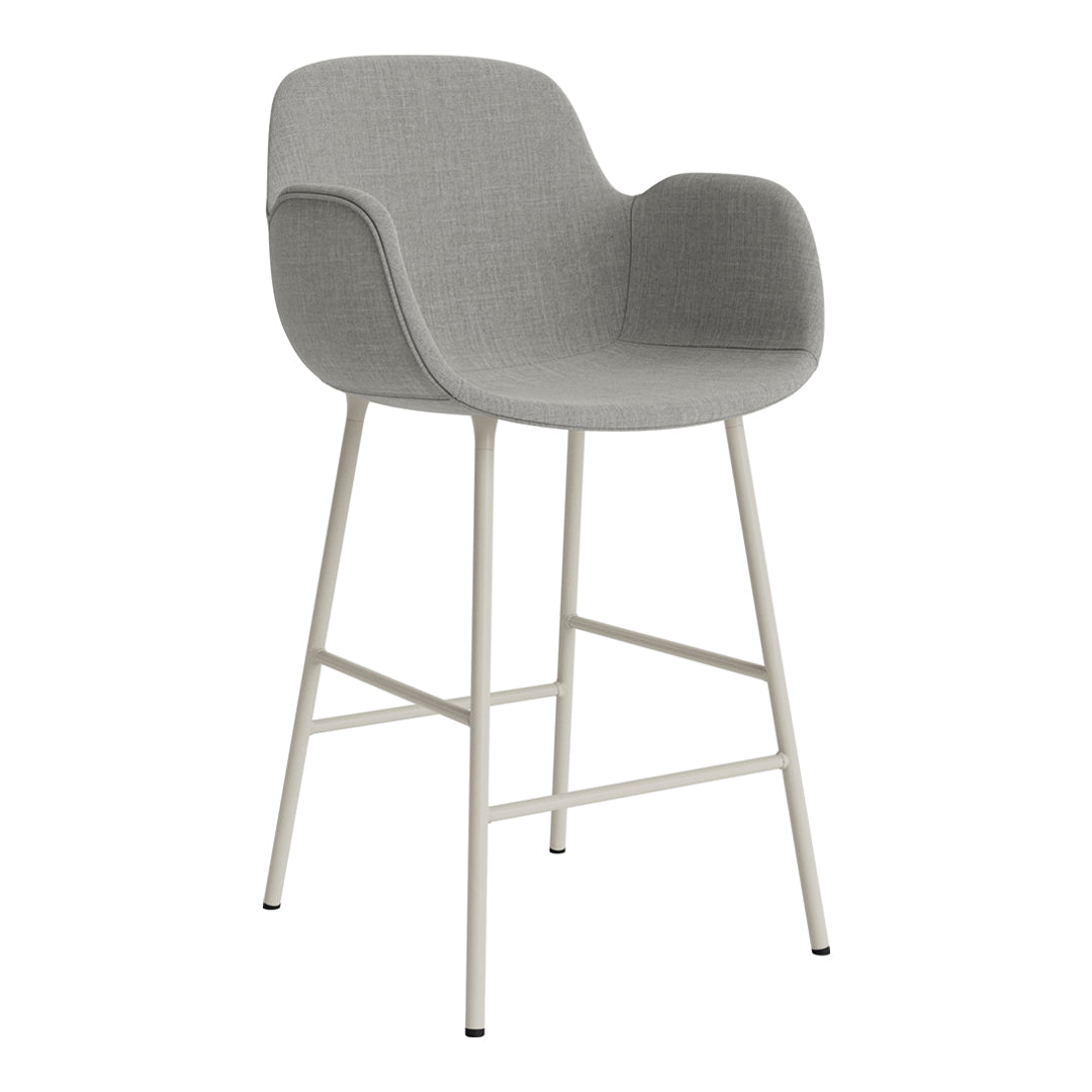 Gray upholstered bar stool with a sleek design and a light-colored metal frame. Minimalistic and modern style.