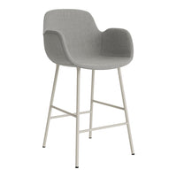 Gray upholstered bar stool with a sleek design and a light-colored metal frame. Minimalistic and modern style.