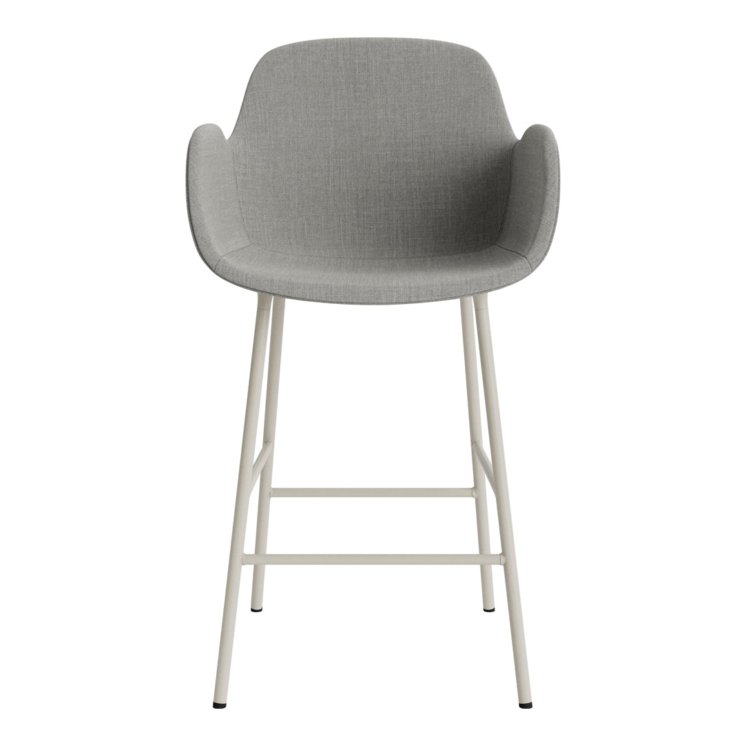 Gray upholstered bar stool with a minimalist design and white metal legs. Ideal for modern interiors.