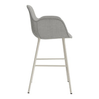 Gray upholstered bar stool with a smooth, minimalist design and light metal legs. Perfect for modern decor.