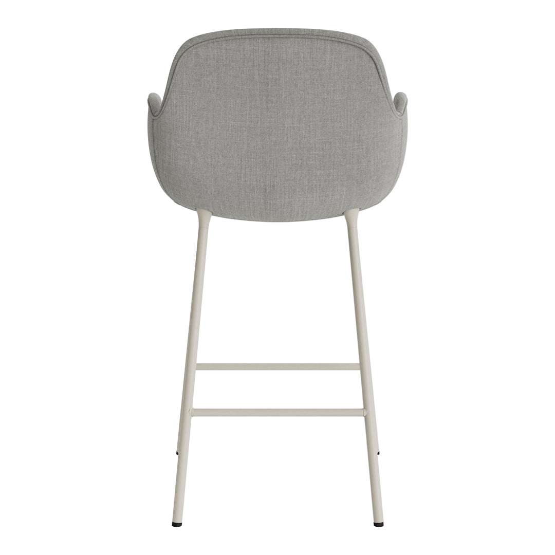 Gray upholstered bar stool with a sleek design and neutral-colored metal legs, perfect for modern decor.
