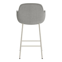 Gray upholstered bar stool with a sleek design and neutral-colored metal legs, perfect for modern decor.