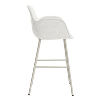 White upholstered bar stool with a minimalist design and light metal legs. Textured fabric adds subtle elegance.