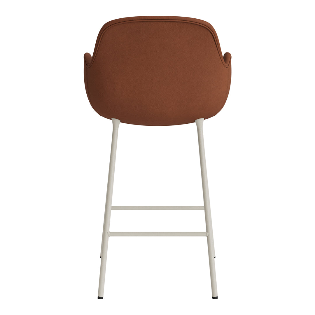 Brown upholstered bar chair with a smooth finish and light metal legs. Modern design for contemporary spaces.
