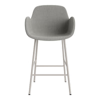 Gray upholstered bar stool with a smooth texture and minimalist white metal legs. Perfect for modern decor.