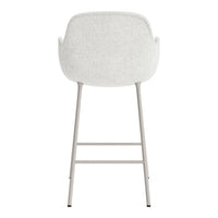 Light grey upholstered chair with a smooth texture and a minimalist silver frame.