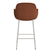 Brown upholstered bar stool with a minimalist design and white metal legs, featuring a smooth, solid color.