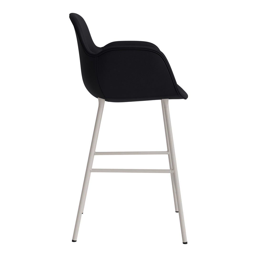 Stylish black upholstered chair with sleek silver metal legs, perfect for modern decor.