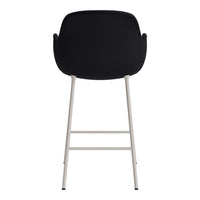 Black upholstered chair with a sleek silver metal frame, minimalist design without patterns.
