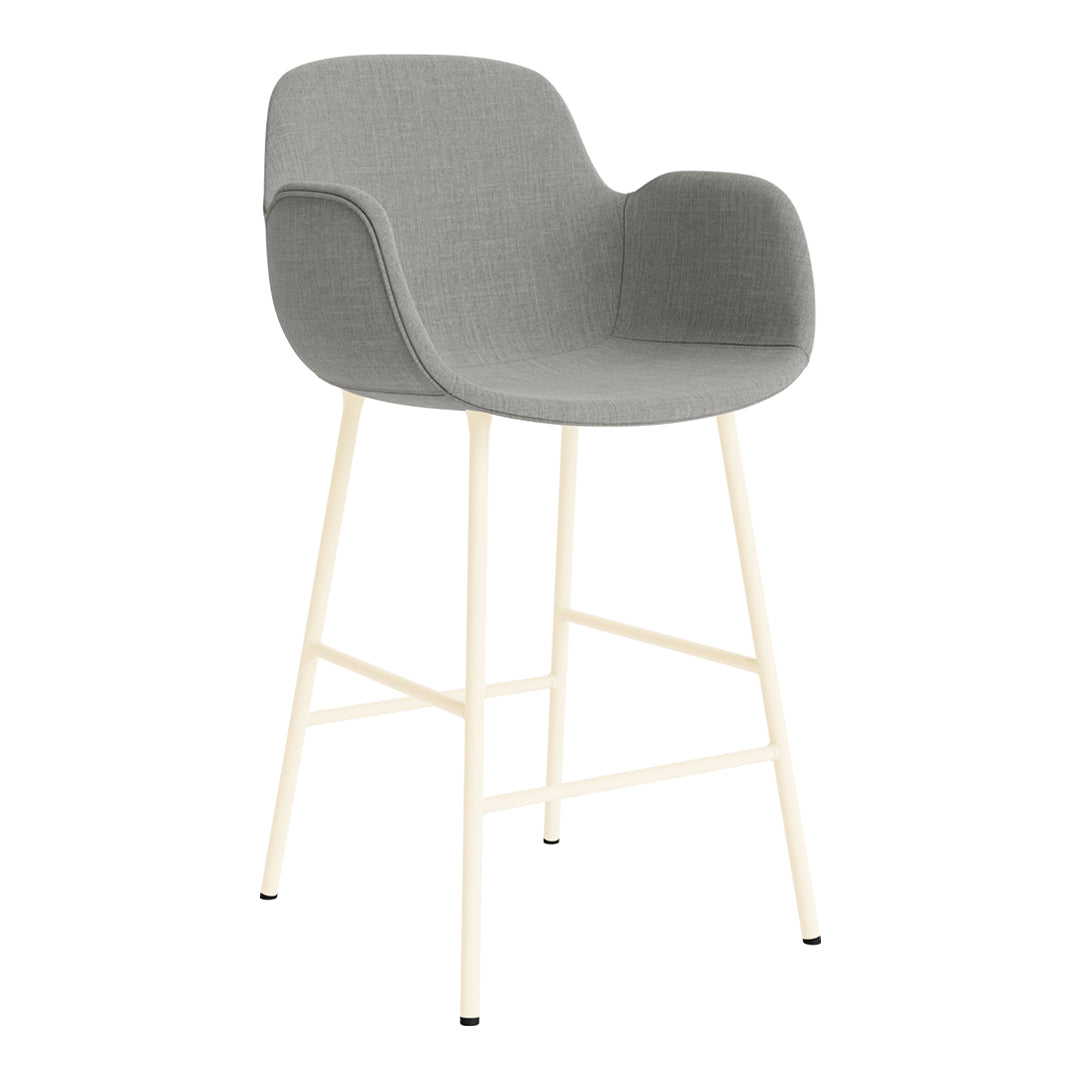 Gray upholstered bar stool with cream metal legs, featuring a smooth, modern design. Perfect for contemporary spaces.