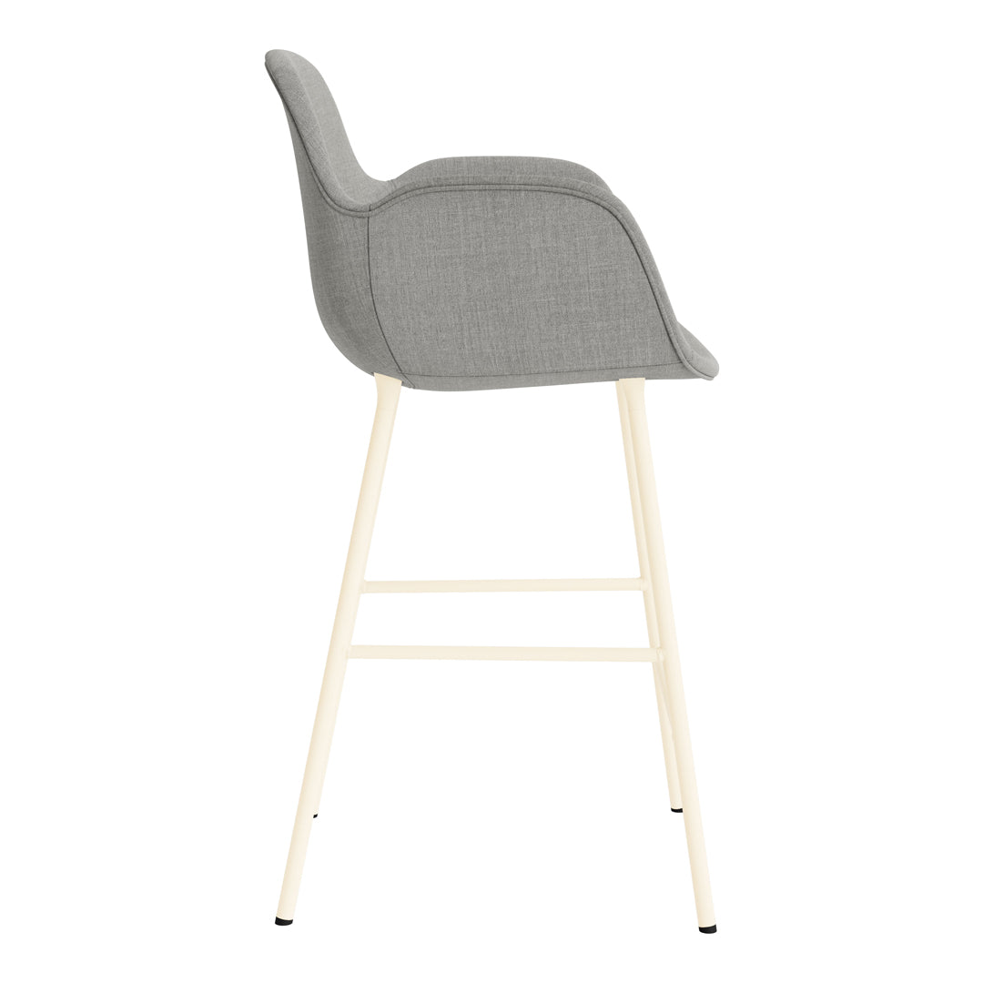 Gray padded bar stool with a minimalistic design and light wood legs, showcasing modern, neutral tones.