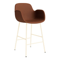 Brown upholstered bar chair with cream-colored legs and minimalistic design. Perfect for modern decor.