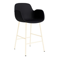 Black upholstered bar stool with minimalist cream metal legs and modern curved design. Ideal for contemporary decor.