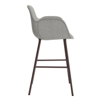 Gray upholstered bar stool with a smooth, minimalist design and dark wooden legs. Perfect for modern spaces.