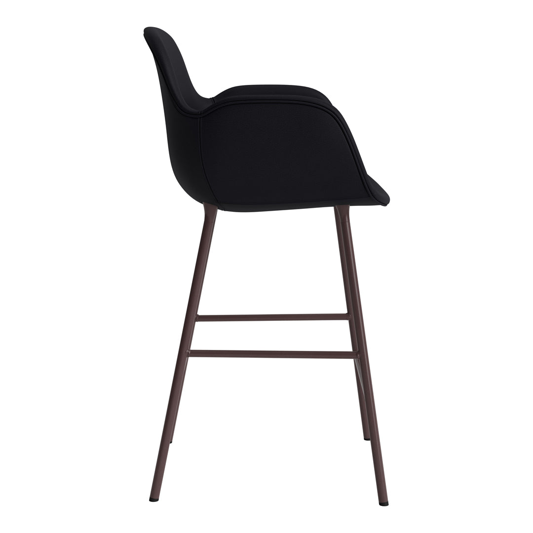 Black upholstered bar stool with sleek design and dark wood legs, showcasing modern aesthetic and minimalist style.