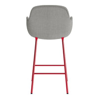 Gray upholstered chair with a sleek design, featuring vibrant red legs for a modern, stylish contrast.