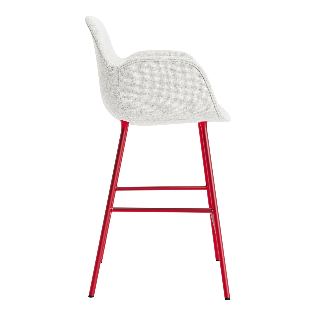 Red and white upholstered bar stool with a modern, sleek design and minimalist style. Perfect for any contemporary space.
