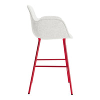 Red and white upholstered bar stool with a modern, sleek design and minimalist style. Perfect for any contemporary space.