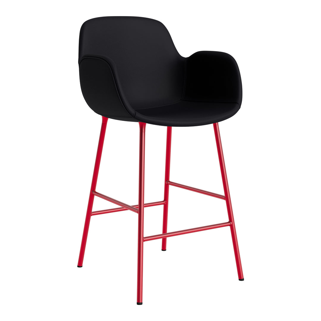 Black bar stool with a sleek design and vibrant red legs, featuring a modern curved seat.