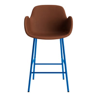 Brown upholstered stool with vibrant blue metal legs, featuring a sleek, modern design. Ideal for any contemporary space.