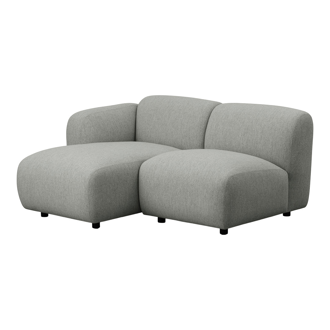 "Soft grey sectional sofa with a modern, rounded design and no visible patterns, ideal for contemporary interiors."