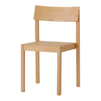 Light oak chair with a minimalist design, featuring smooth grain patterns and a natural wood finish.