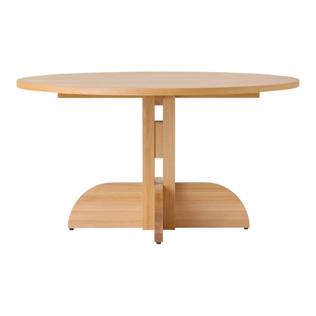 Round wooden dining table in a light natural finish with a smooth surface and minimalist design. Perfect for modern decor.