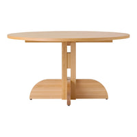 Round wooden dining table in a light natural finish with a smooth surface and minimalist design. Perfect for modern decor.