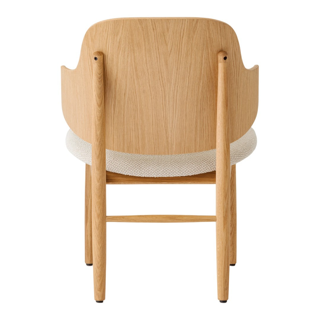 Light wood chair with a cream upholstered seat and smooth, minimalist design. Perfect blend of natural tones.