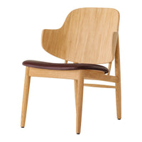 Natural wood chair with a light bamboo finish and a rich brown leather seat for a modern, minimalist style.