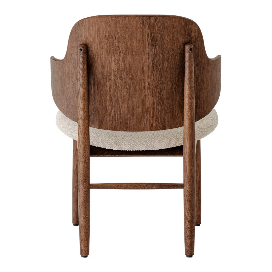 Wooden chair with a rich brown finish and a soft cream upholstered seat, showcasing a minimalist design.