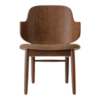 Brown wooden chair with smooth curves and a textured fabric seat, highlighting natural wood grain patterns.