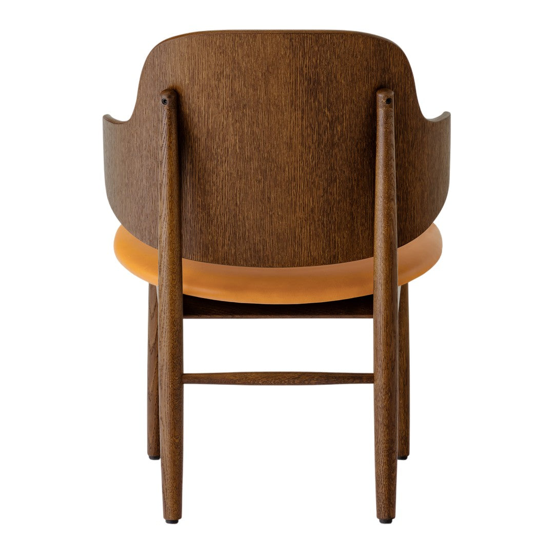 Brown wooden chair with a smooth orange seat, featuring a minimalist design and clean lines.