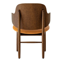 Brown wooden chair with a smooth orange seat, featuring a minimalist design and clean lines.