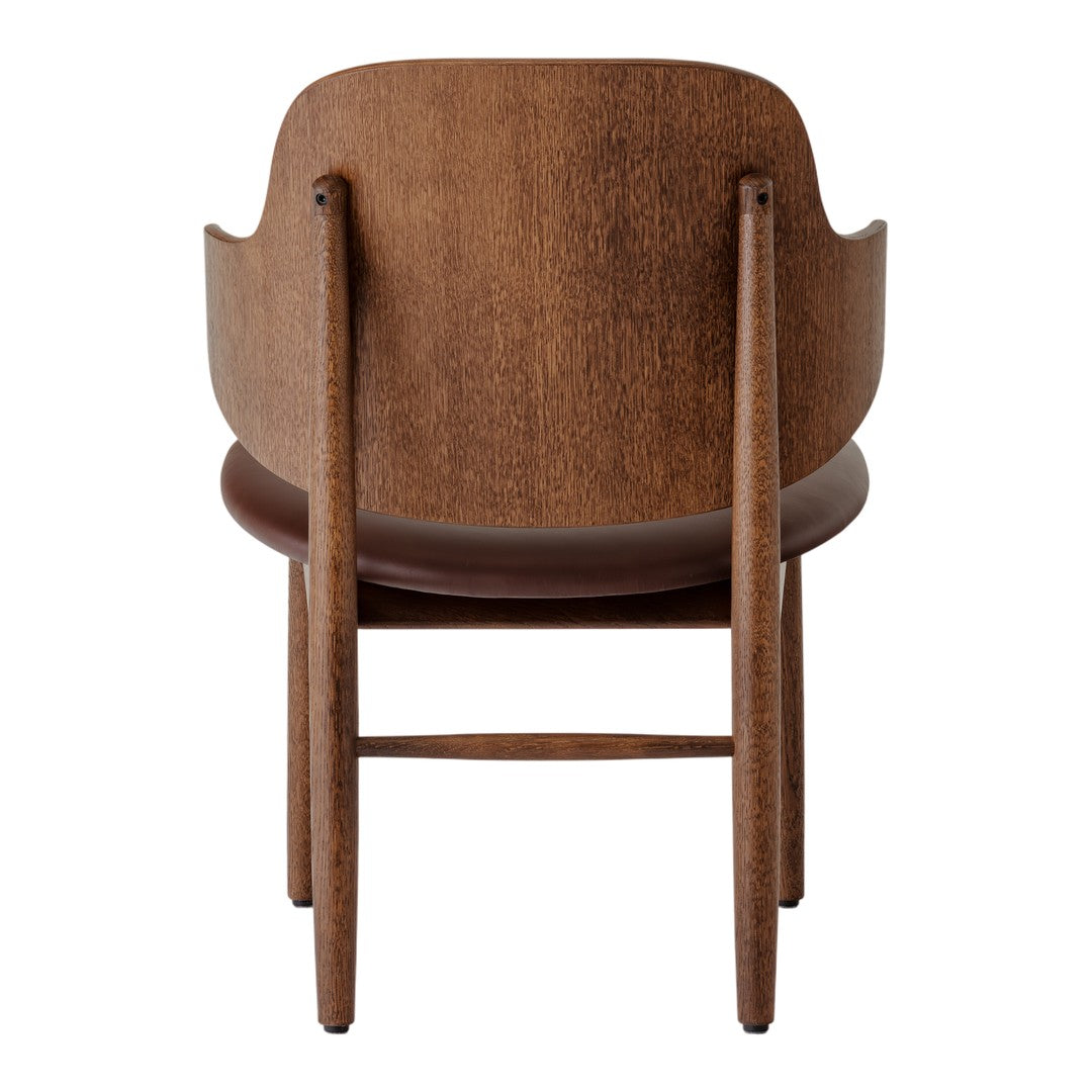 Back view of a sleek wooden chair in rich brown tones with a smooth texture, showcasing minimalist design and elegant lines.
