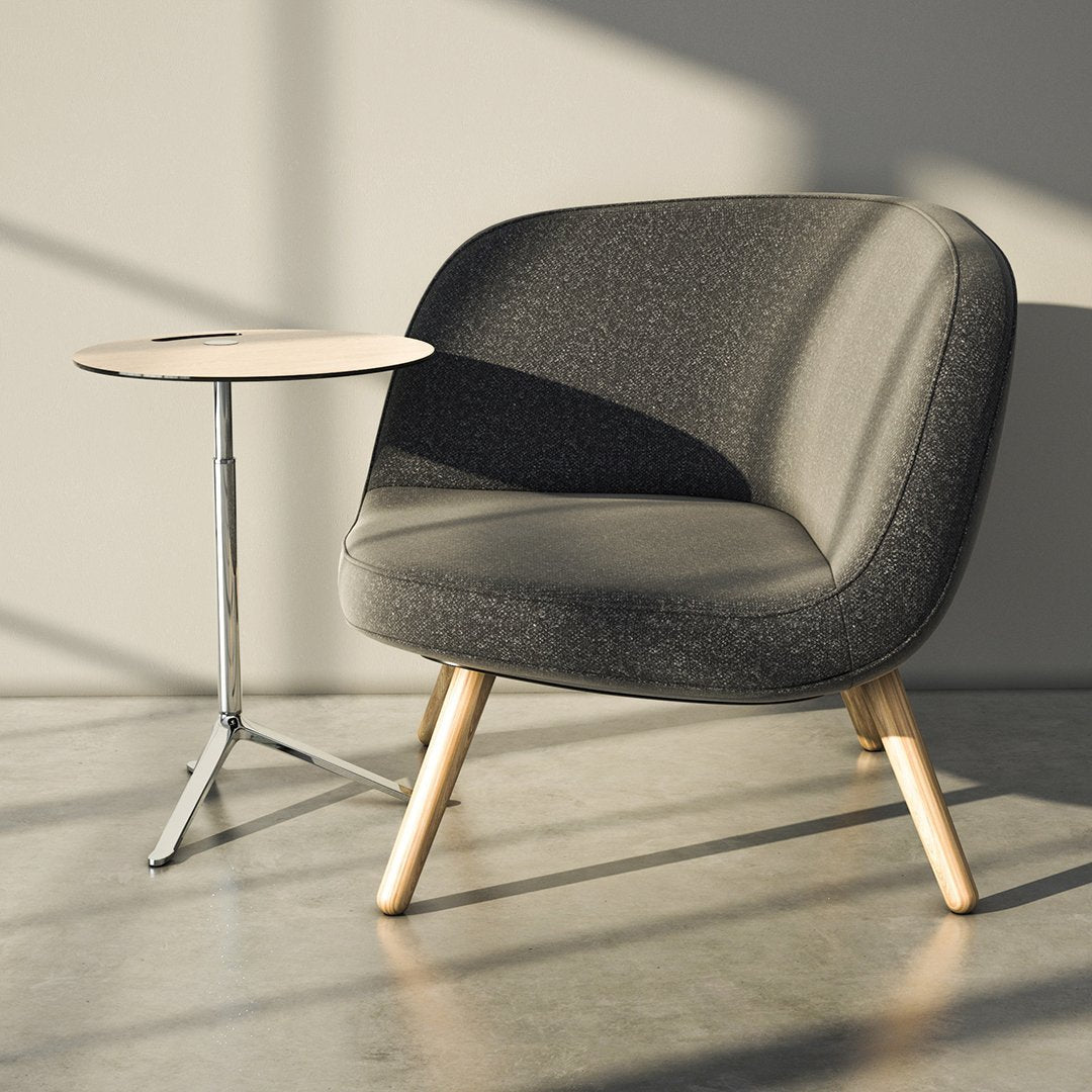 Grey upholstered chair with a textured pattern, complemented by light wooden legs and a minimalist white side table.
