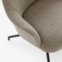 Neutral beige upholstered chair with a smooth, textured pattern and black metal legs. Perfect for modern decor.