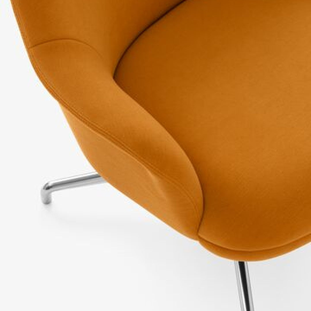 Orange upholstered chair with smooth curves and a sleek chrome base, featuring a minimalistic design.
