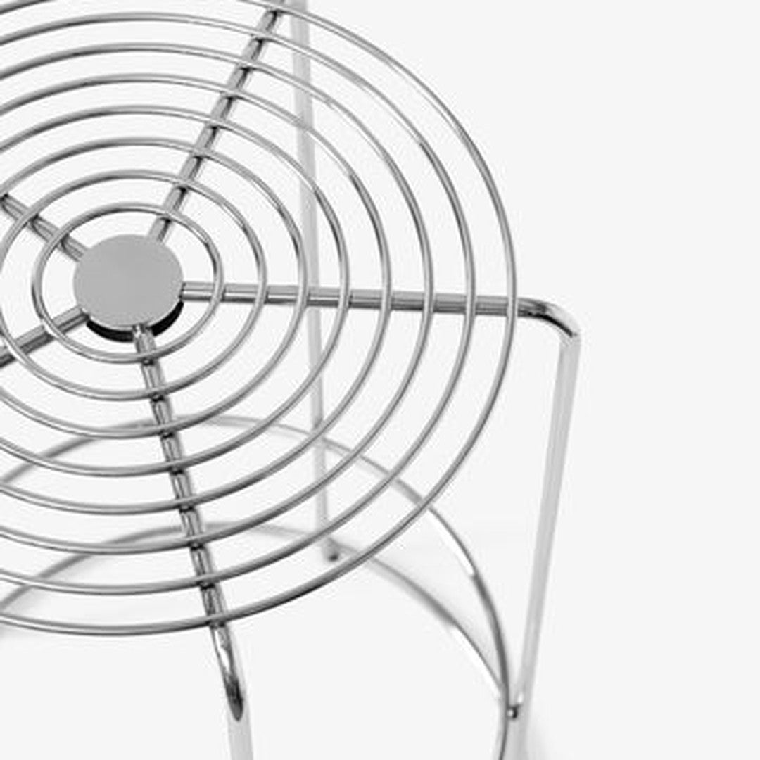 Chrome wire stool with circular pattern and sleek, modern design against a white background.