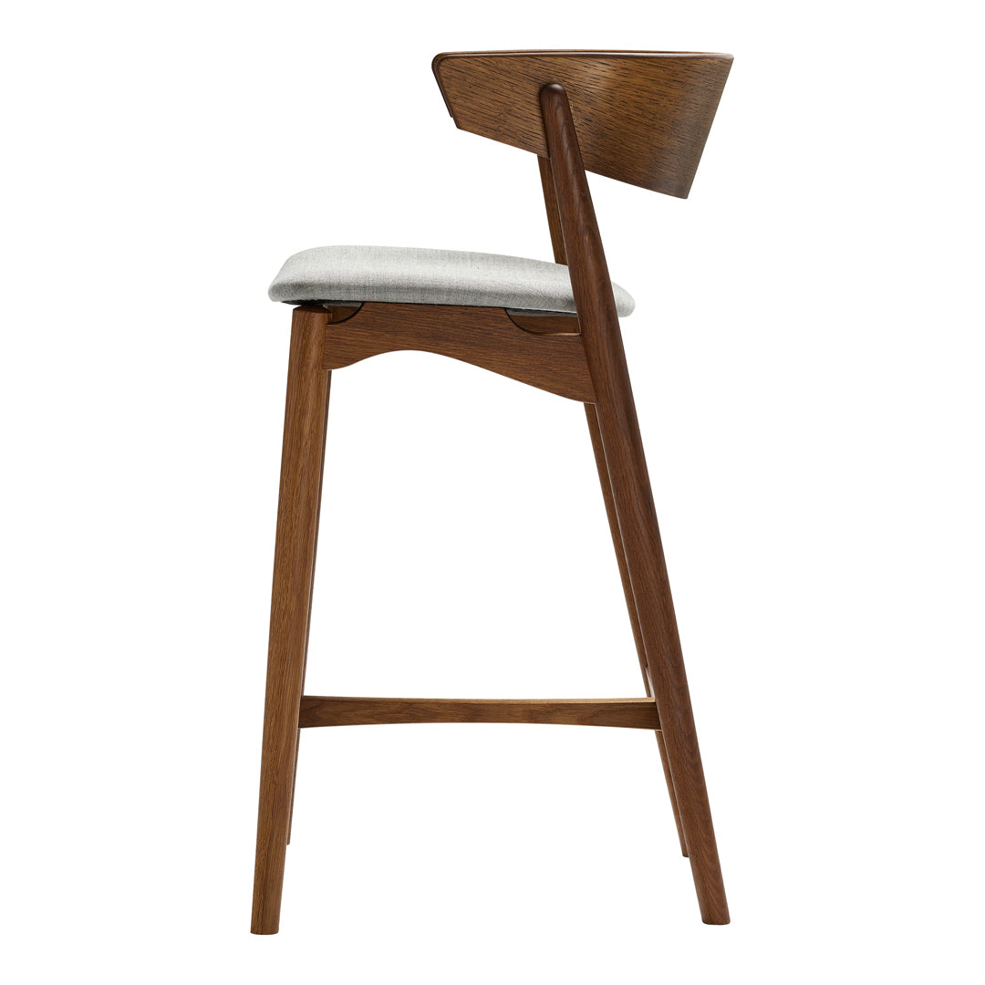 Wooden bar stool with a rich brown finish and light gray upholstered seat, featuring clean, modern lines.