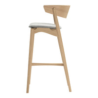 Light wood bar stool with a minimalist design, featuring a neutral gray seat and stylish angled backrest.
