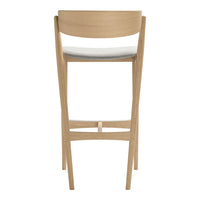 Light wood bar stool featuring a sleek, minimalist design with a white upholstered seat for a modern look.